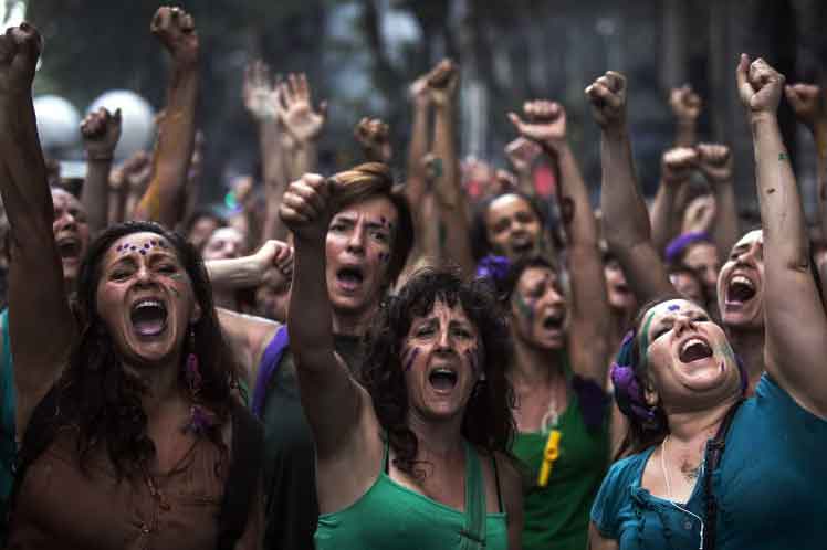 a group of people with their hands up